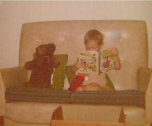 Rob reading to his toys at age two